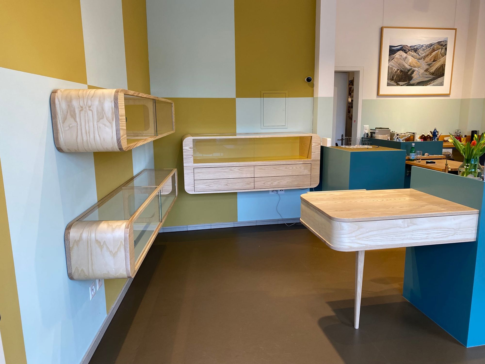 Wall-hung units and a desk in one room