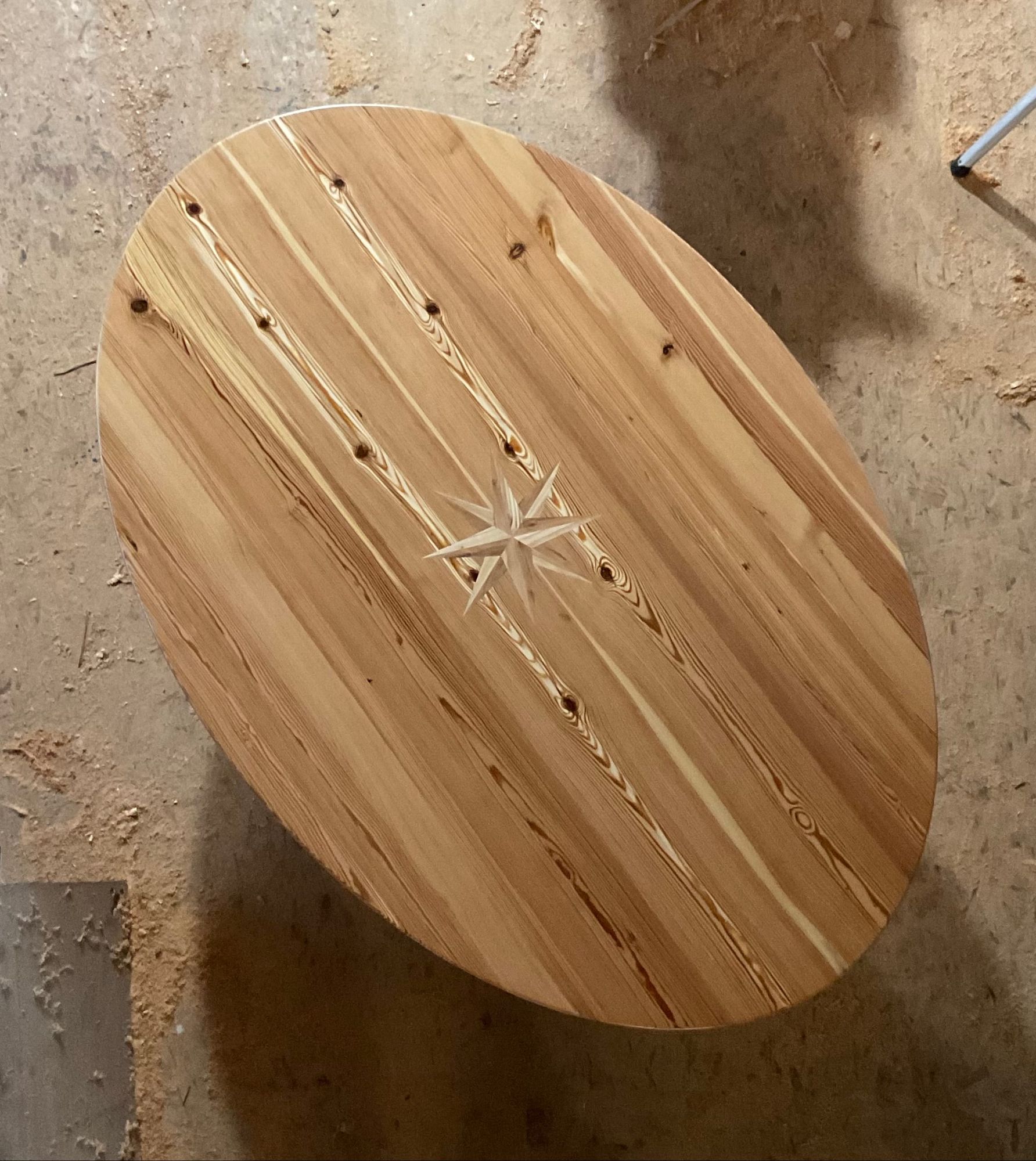 Oval top with an inlaid star