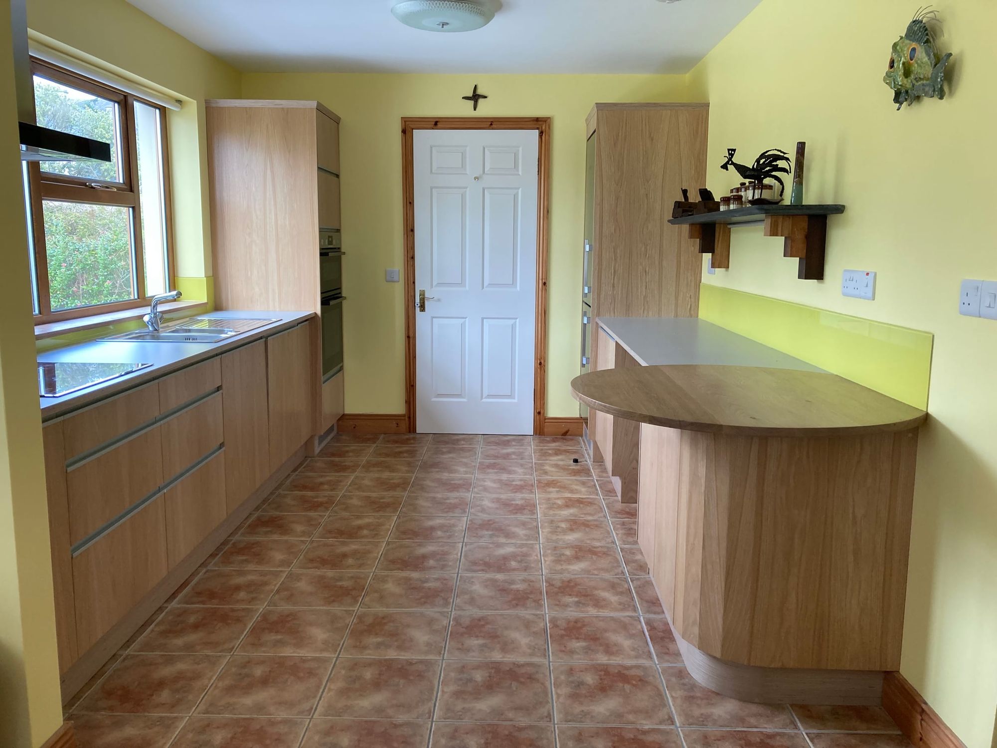 Kitchen with a curved counter