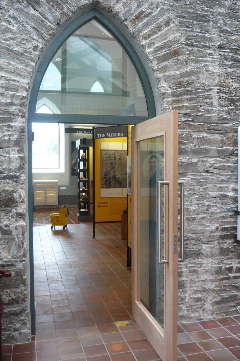 Glazed door in a stone arch